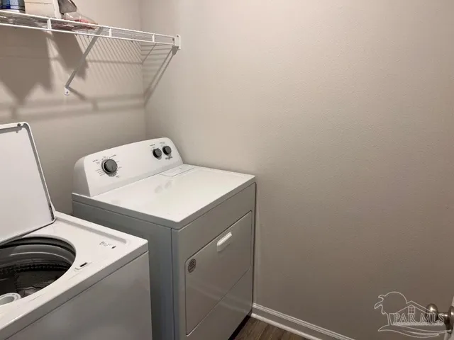 a utility room with dryer and washer