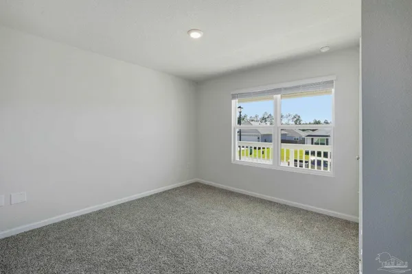 a view of an empty room and window