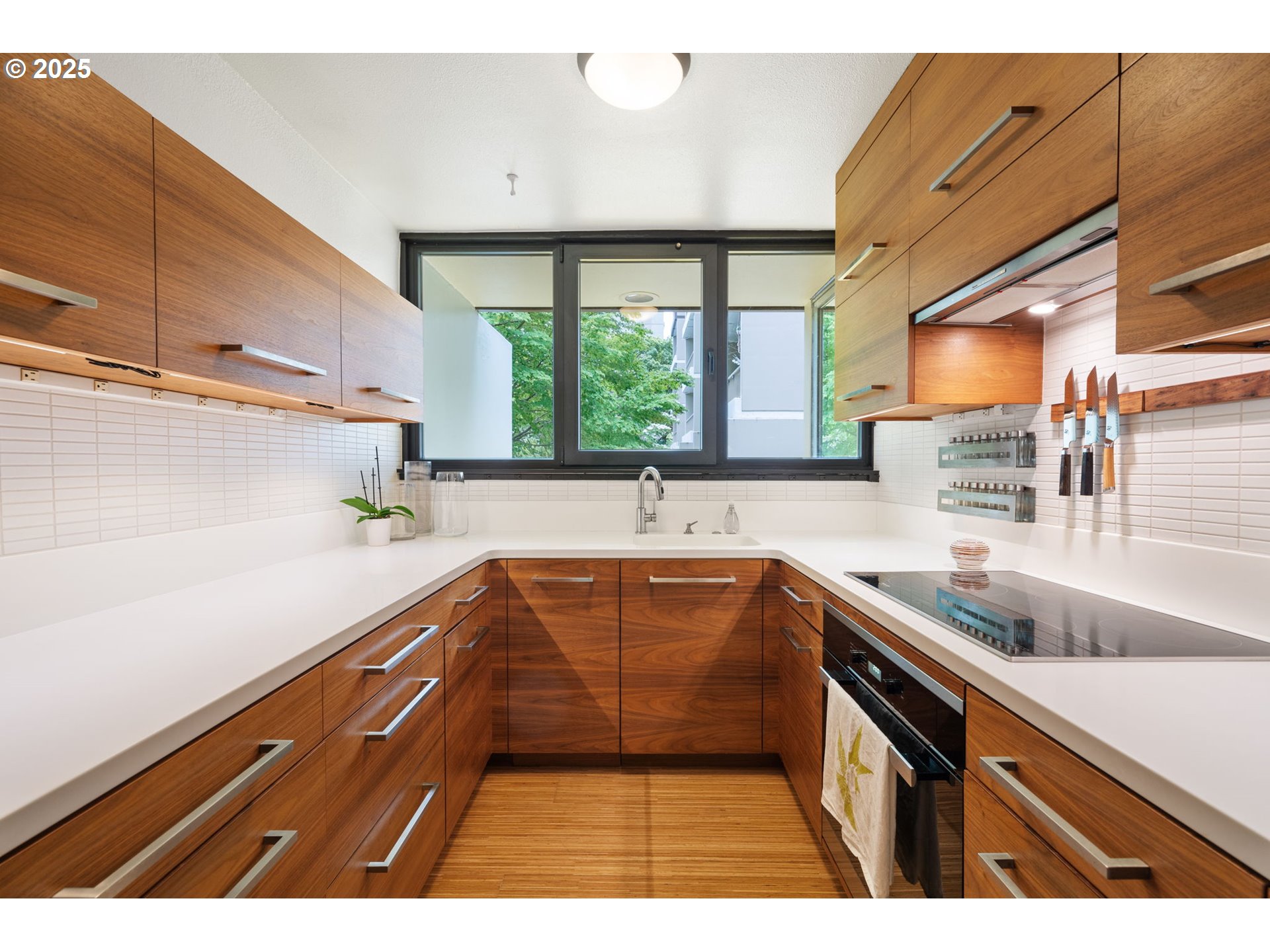 255 Southwest Harrison Street, Unit TH5 Portland, OR 97201 - Photo 13 of 40 a kitchen with a sink and large window