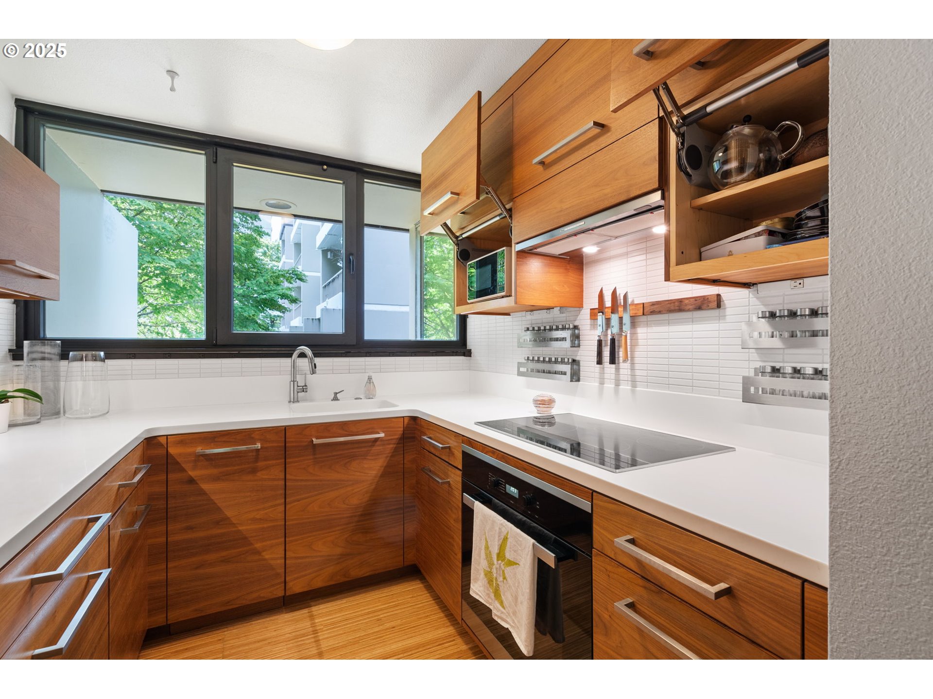 255 Southwest Harrison Street, Unit TH5 Portland, OR 97201 - Photo 16 of 40 a kitchen with a sink and large window