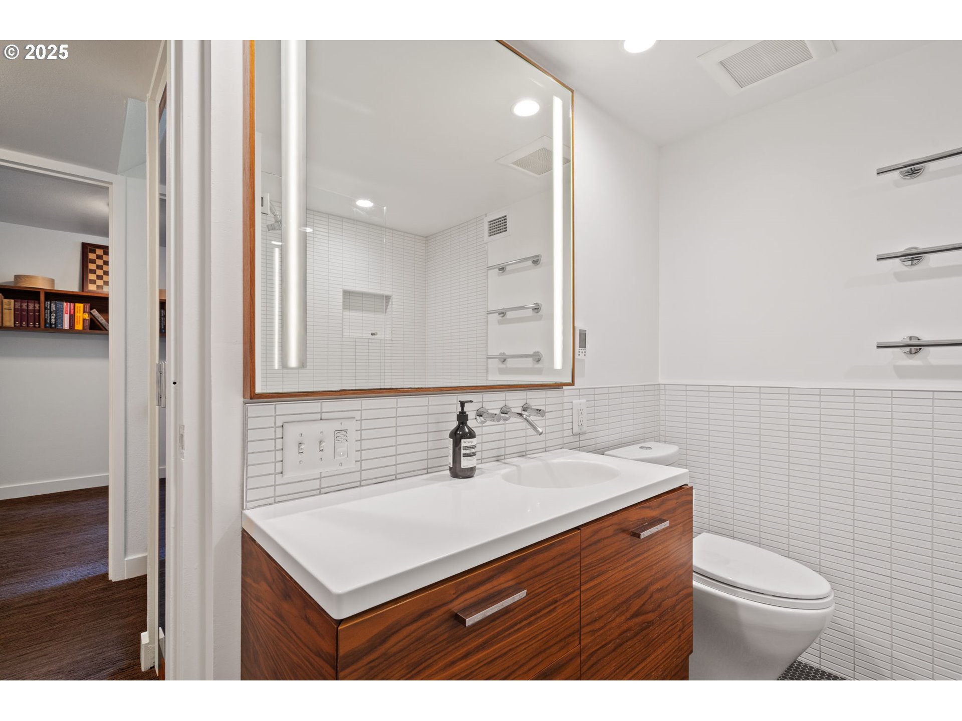 255 Southwest Harrison Street, Unit TH5 Portland, OR 97201 - Photo 27 of 40 a bathroom with a sink toilet and mirror