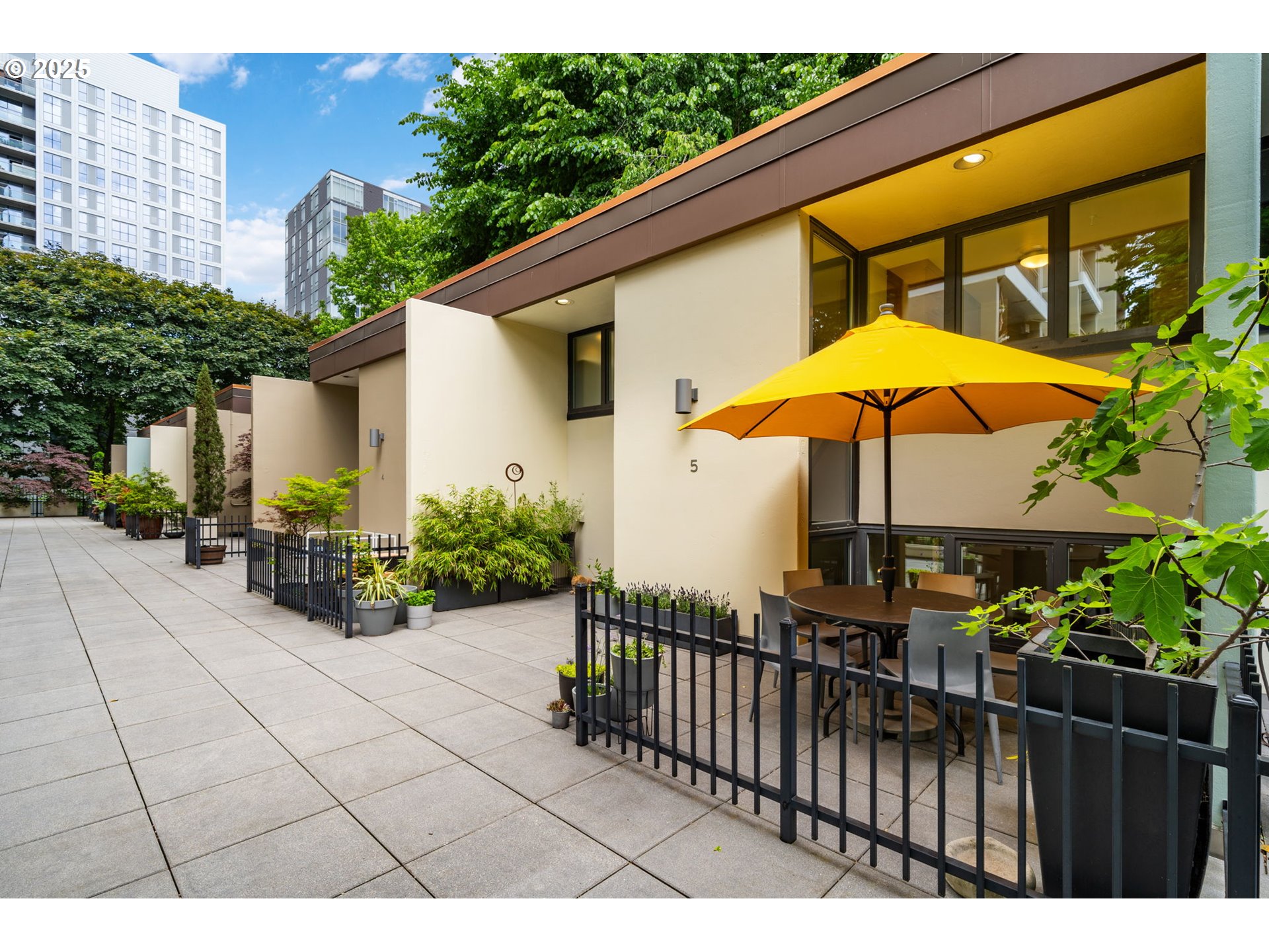 255 Southwest Harrison Street, Unit TH5 Portland, OR 97201 - Photo 29 of 40 a view of a backyard with sitting area