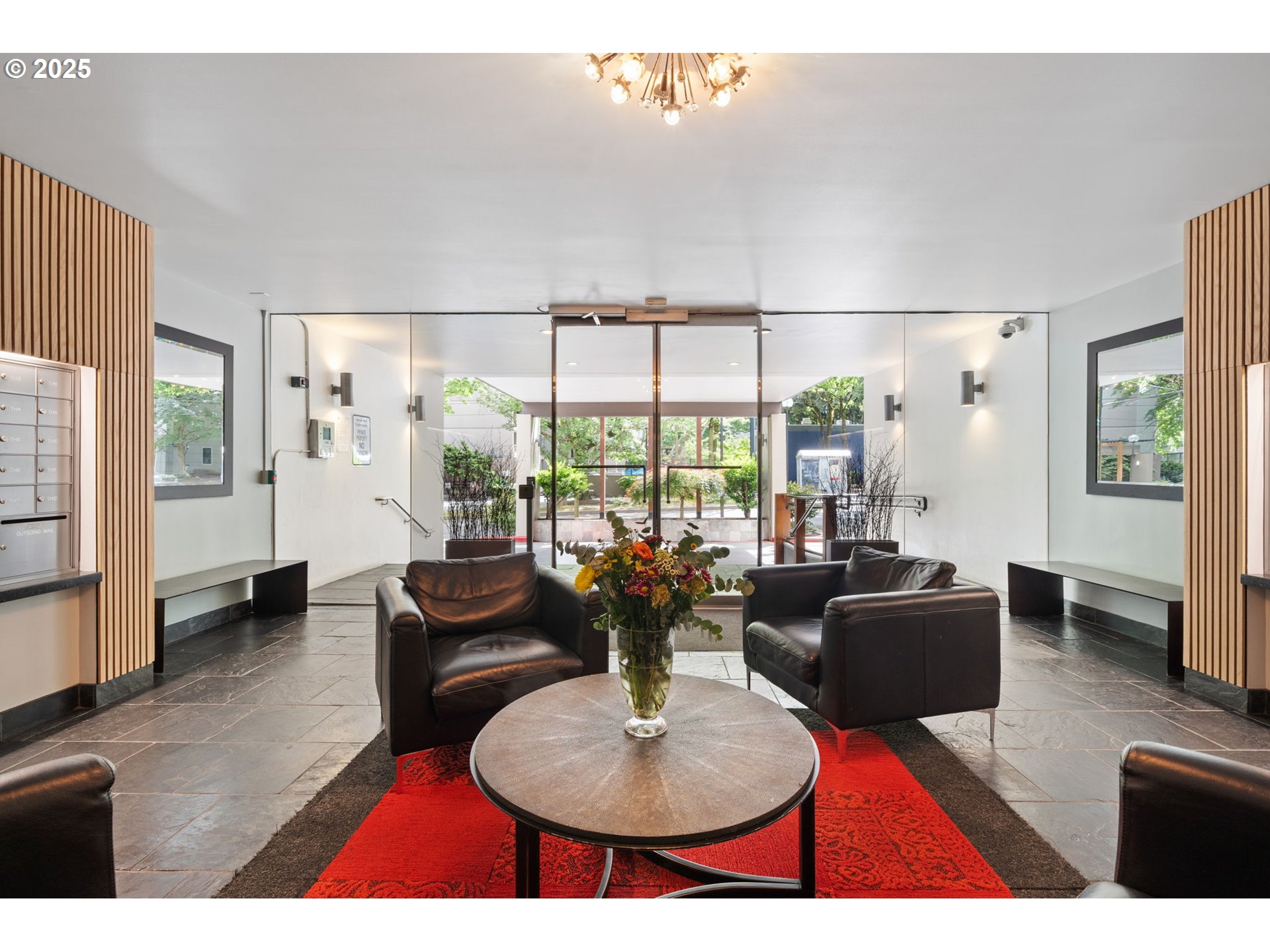 255 Southwest Harrison Street, Unit TH5 Portland, OR 97201 - Photo 34 of 40 a living room with furniture potted plant and a large window