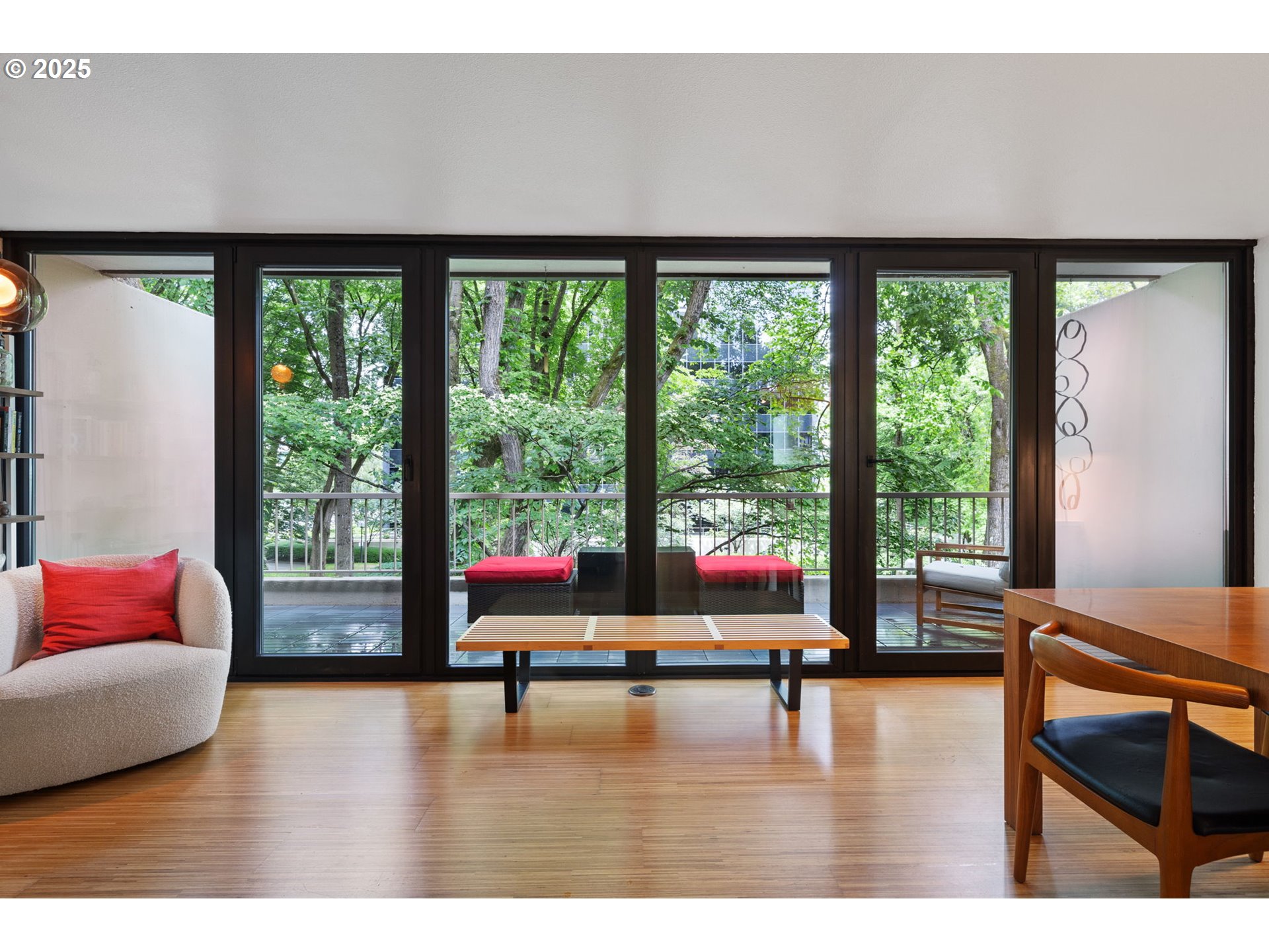 255 Southwest Harrison Street, Unit TH5 Portland, OR 97201 - Photo 5 of 40 a living room with furniture and floor to ceiling window