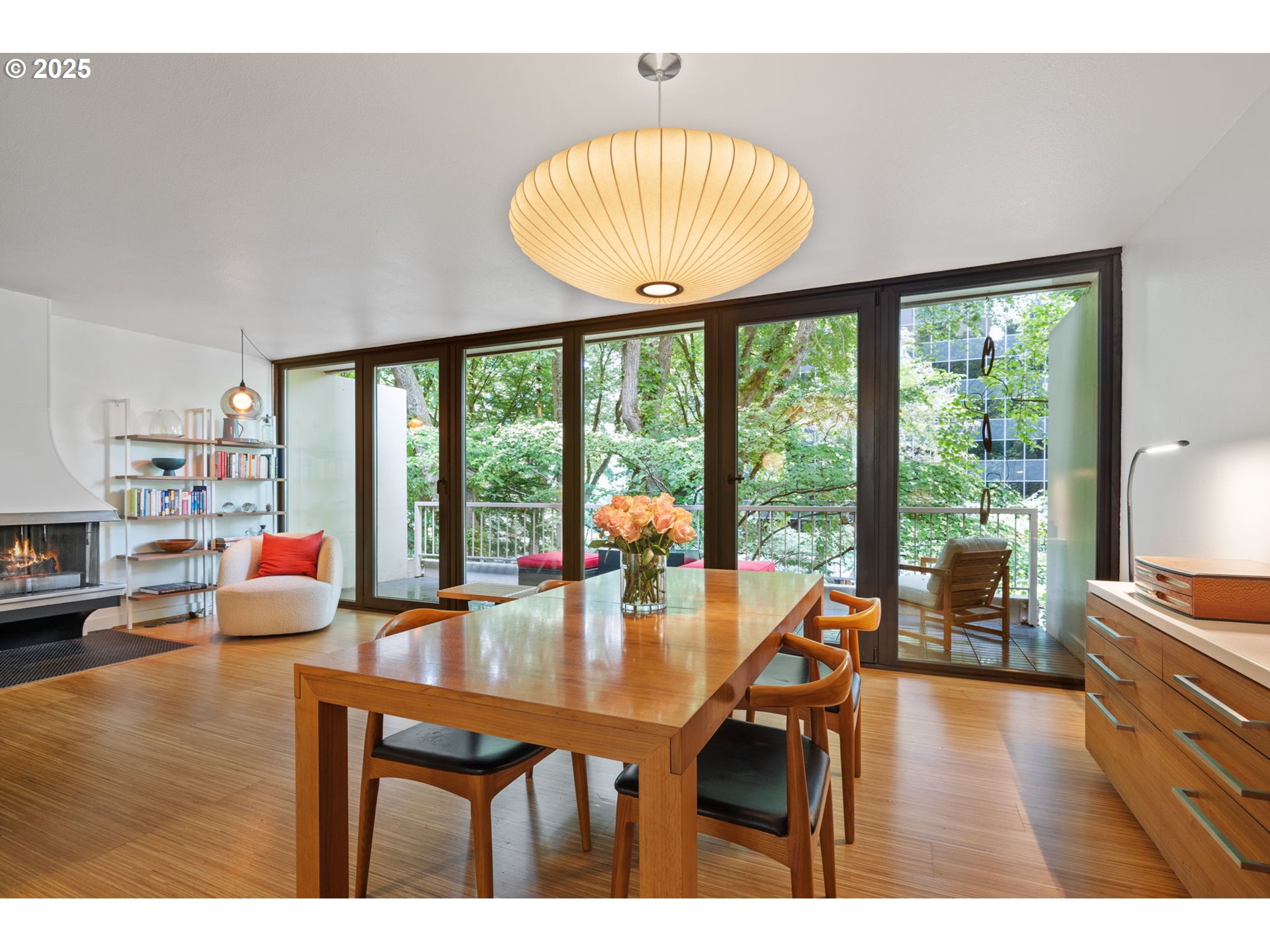 255 Southwest Harrison Street, Unit TH5 Portland, OR 97201 - Photo 7 of 40 a dining room with wooden floor and a floor to ceiling window
