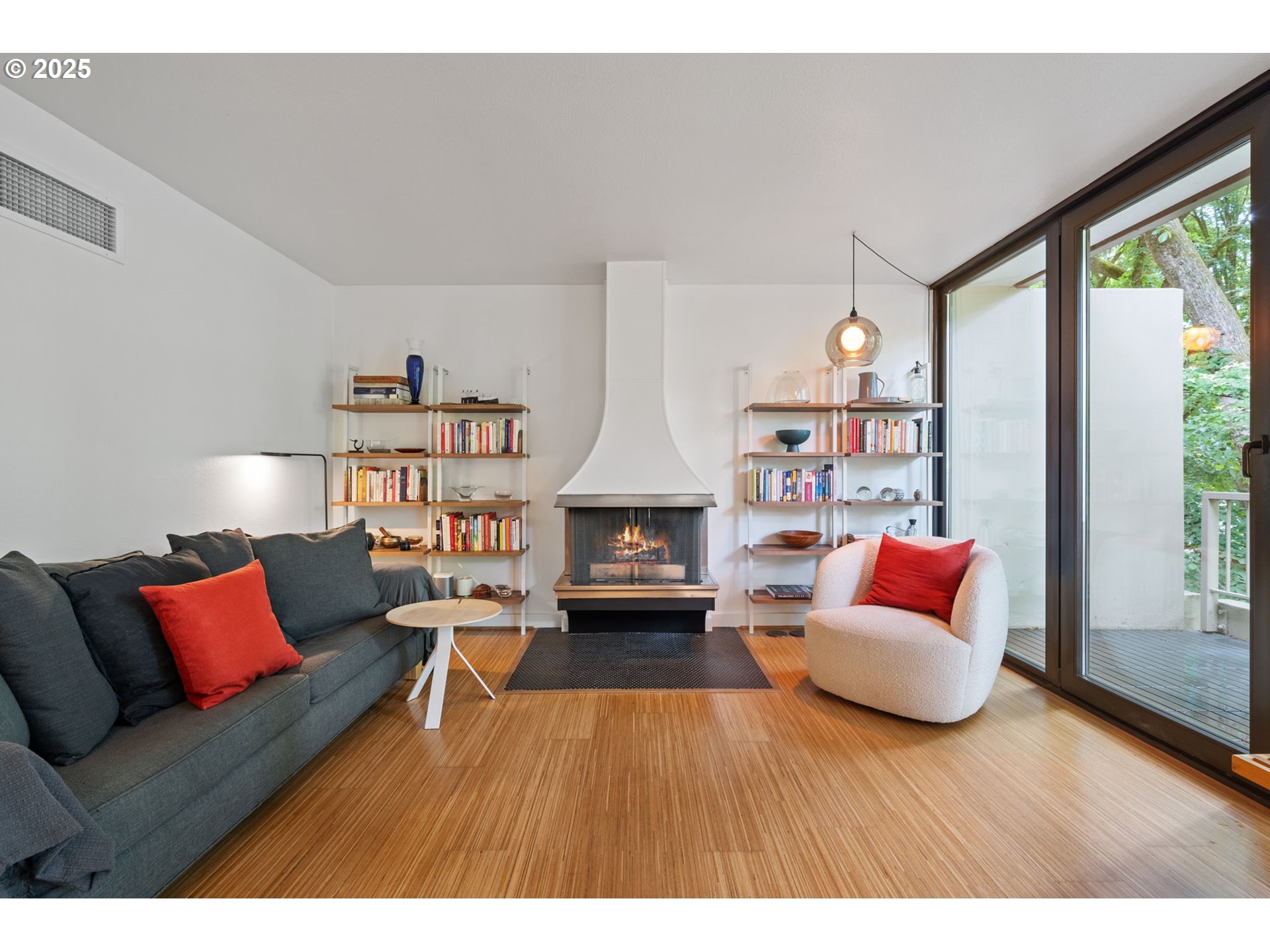 255 Southwest Harrison Street, Unit TH5 Portland, OR 97201 - Photo 8 of 40 a living room with furniture and a fireplace