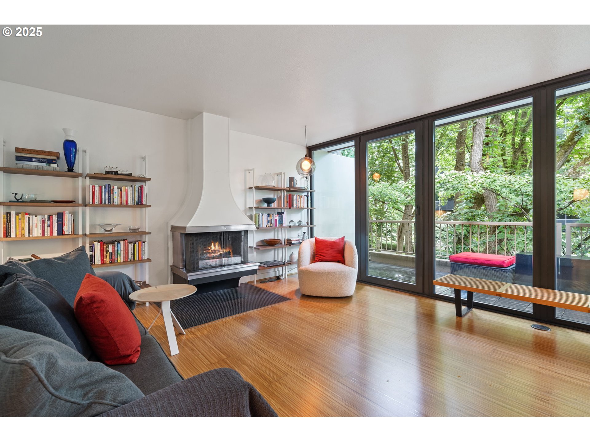 255 Southwest Harrison Street, Unit TH5 Portland, OR 97201 - Photo 10 of 40 a living room with furniture fireplace and a large window