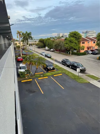 a view of car parked in front of building