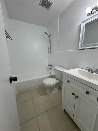 an empty room with a bathroom