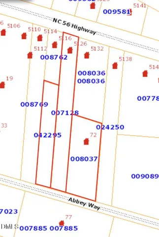 a white refrigerator with white cabinets