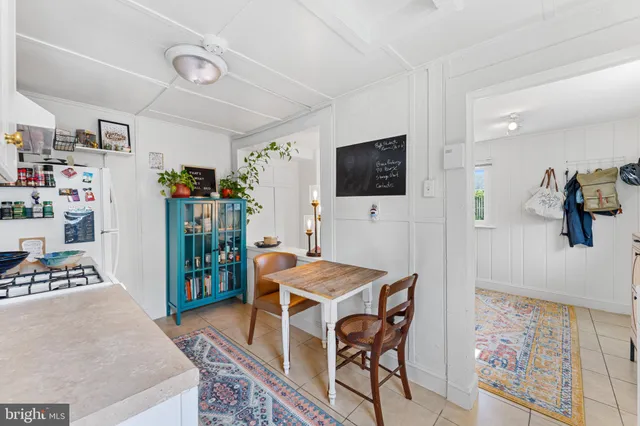 a view of a livingroom with furniture and a flat screen tv