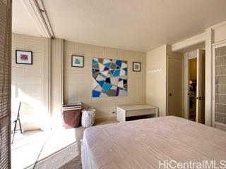 a bedroom with a bed and wall painting