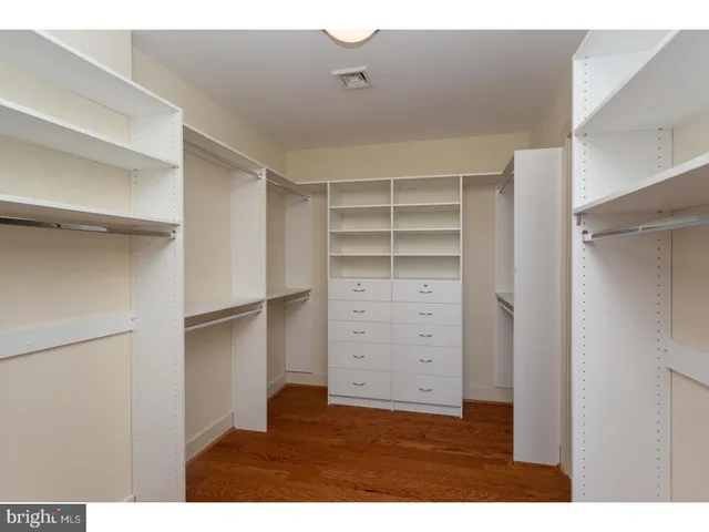 a view of an empty walk in closet