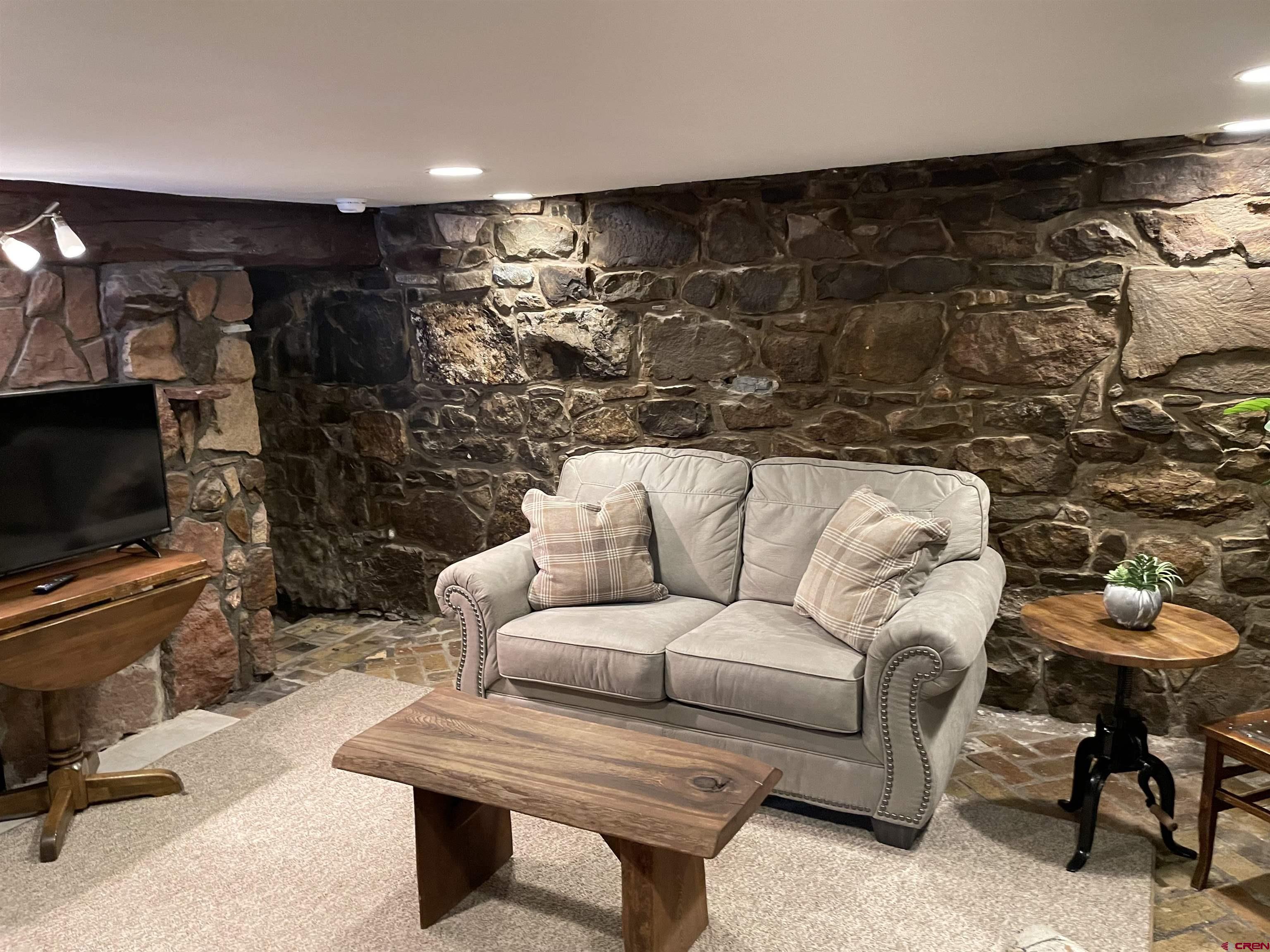 232 Main Street Ouray, CO 81427 - Photo 15 of 21 Living Room in lower-level rustic, historic apartment