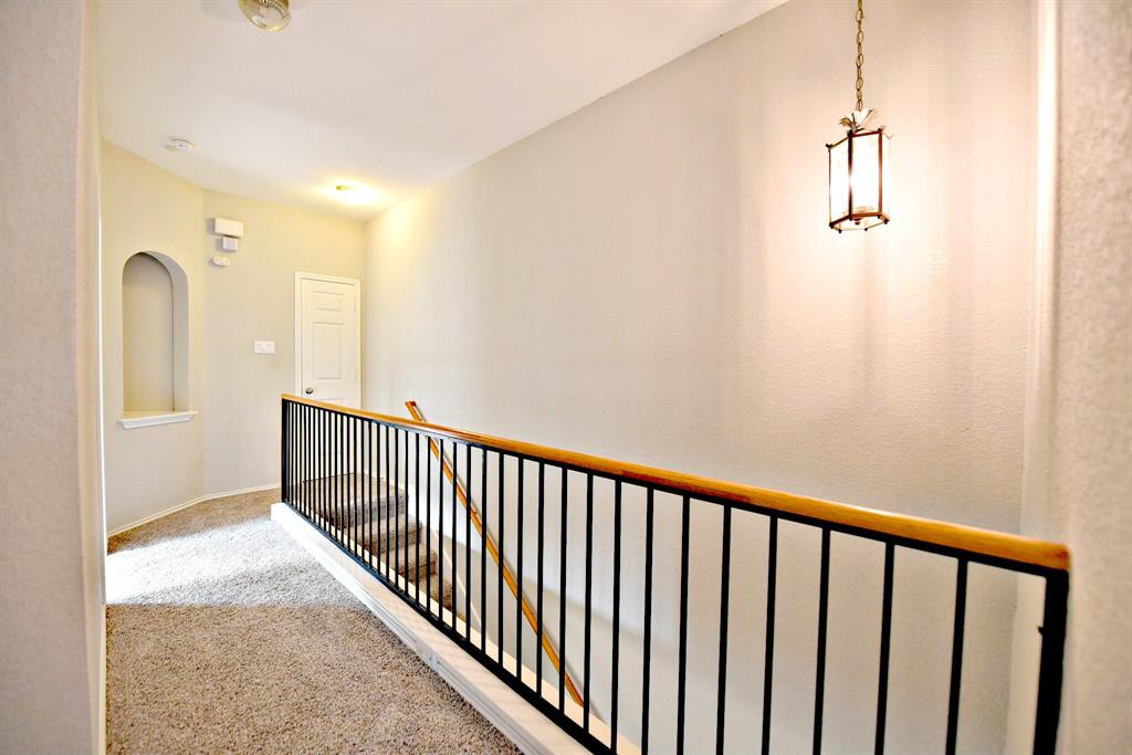 14815 Avery Ranch Boulevard, Unit 702 Austin, TX 78717 - Photo 10 of 19 Hall featuring an upstairs landing and carpet