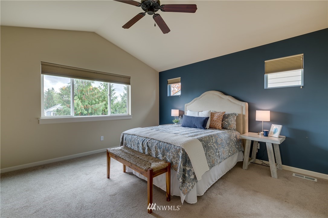 1532 170th Street Southeast Bothell, WA 98012 - Photo 18 of 39 a bedroom with a bed and a window