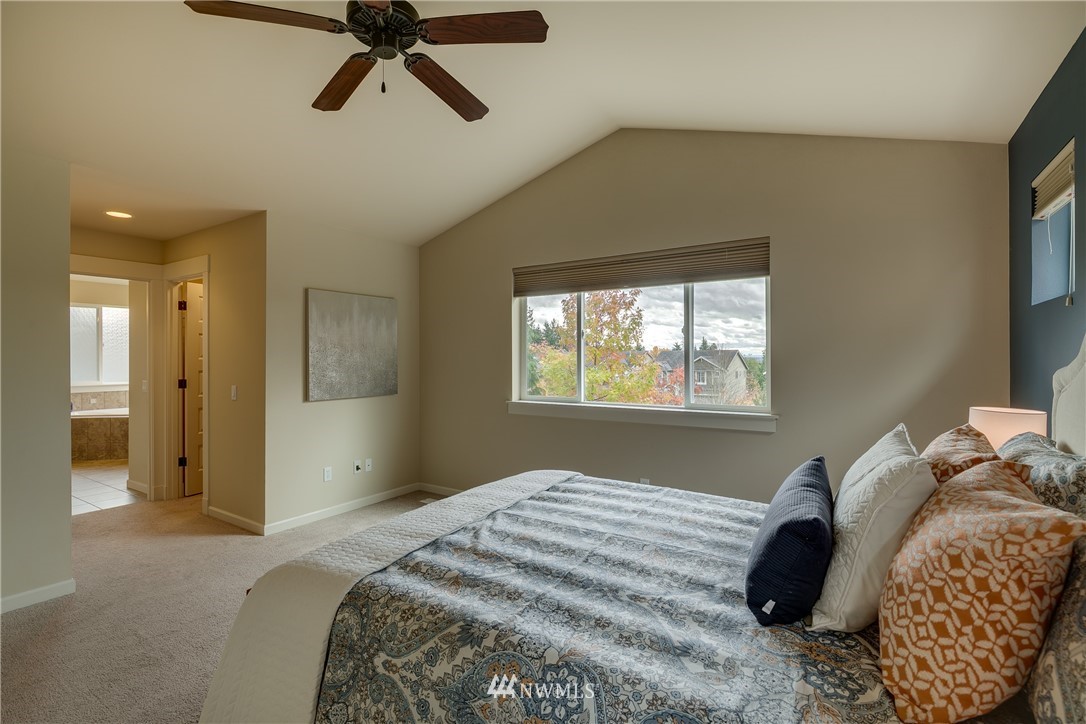1532 170th Street Southeast Bothell, WA 98012 - Photo 20 of 39 a bedroom with a bed and a window
