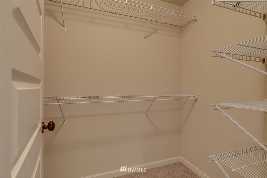 1532 170th Street Southeast Bothell, WA 98012 - Photo 22 of 39 a view of a room with racks on the wall