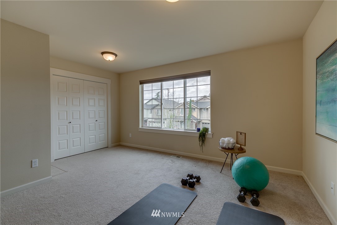 1532 170th Street Southeast Bothell, WA 98012 - Photo 28 of 39 a room with window and a chandelier fan