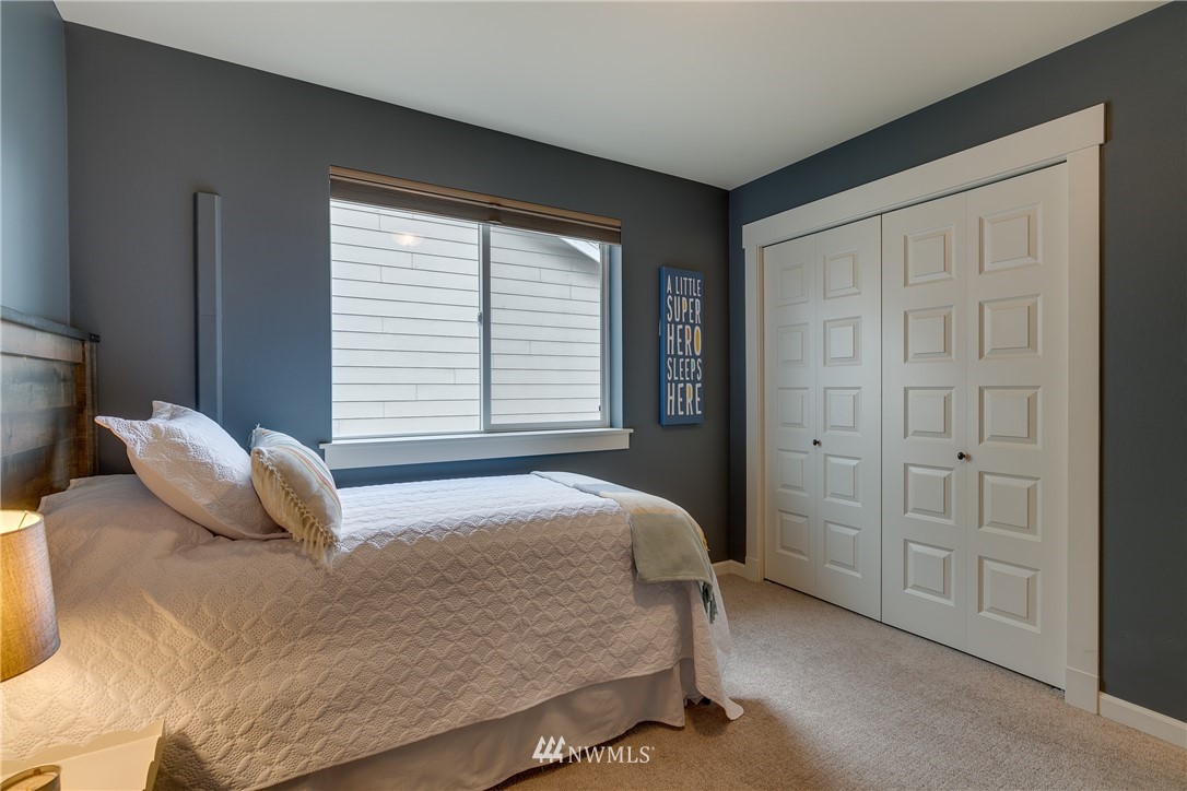 1532 170th Street Southeast Bothell, WA 98012 - Photo 30 of 39 a bedroom with a bed and a window