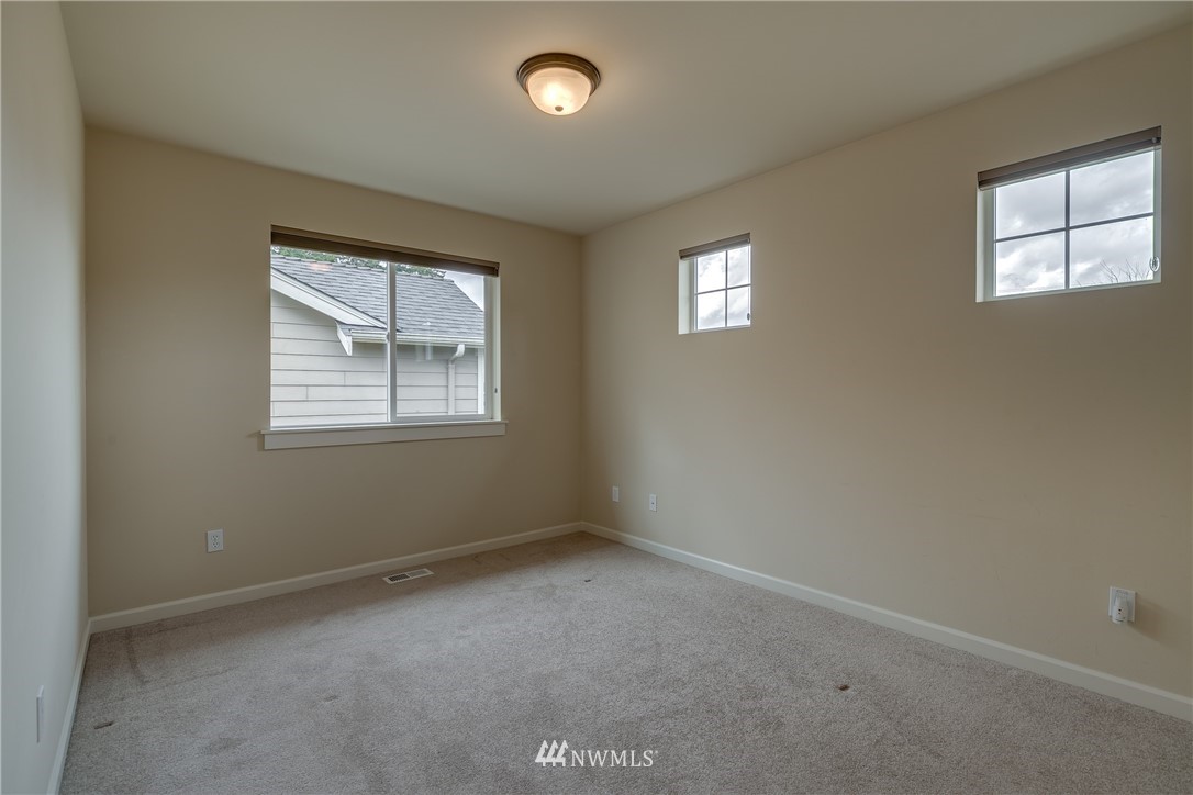 1532 170th Street Southeast Bothell, WA 98012 - Photo 31 of 39 an empty room with windows