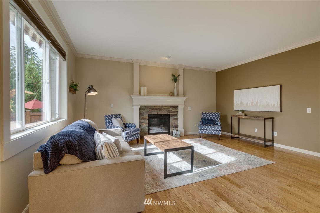 1532 170th Street Southeast Bothell, WA 98012 - Photo 10 of 39 a living room with furniture and a fireplace