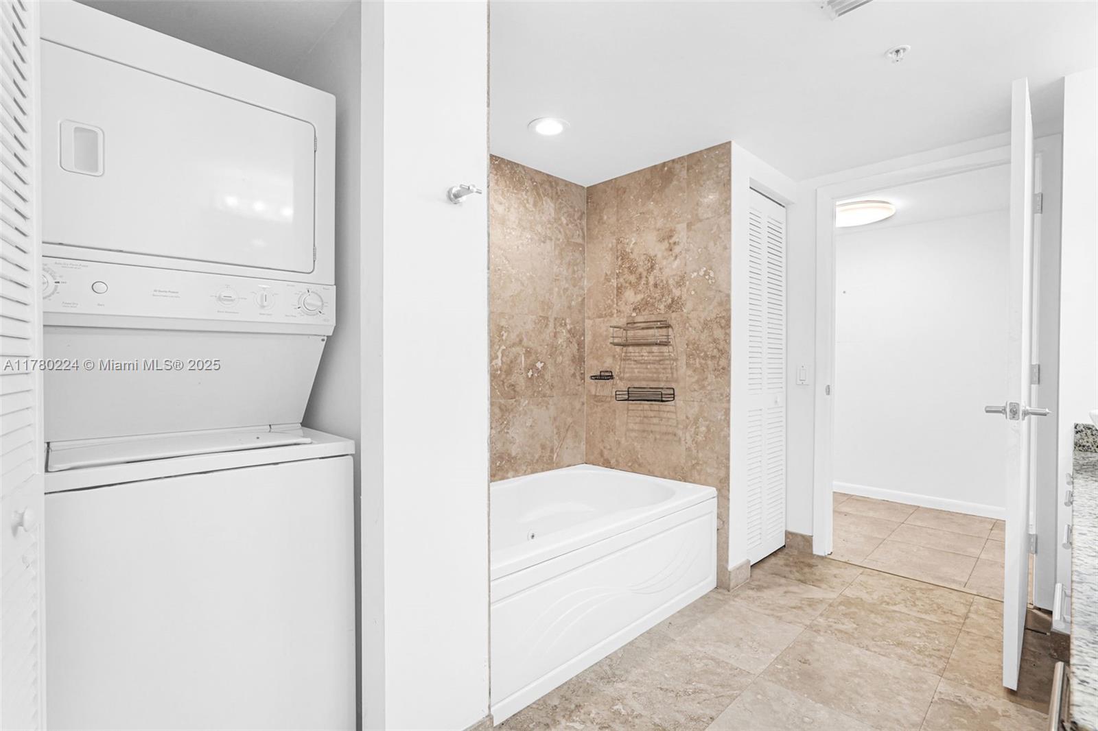 41 Southeast 5th Street, Unit 406 Miami, FL 33131 - Photo 20 of 68 a bathroom with a tub and a shower