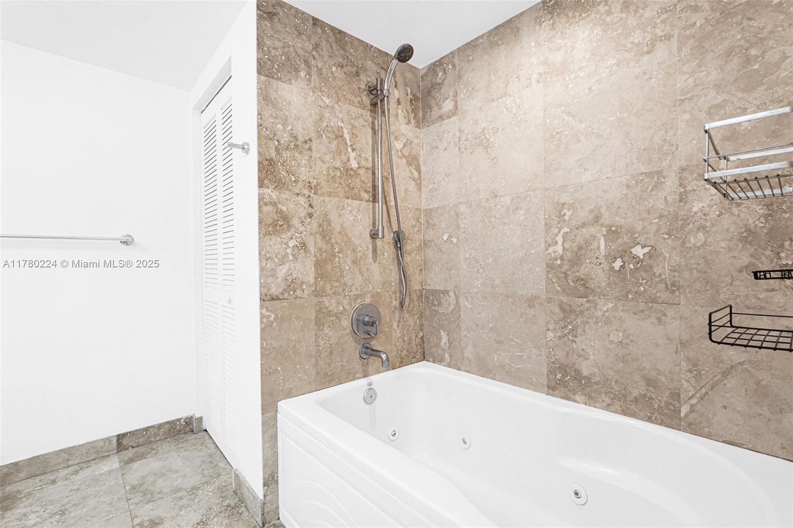 41 Southeast 5th Street, Unit 406 Miami, FL 33131 - Photo 24 of 68 a bathroom with a bathtub and shower