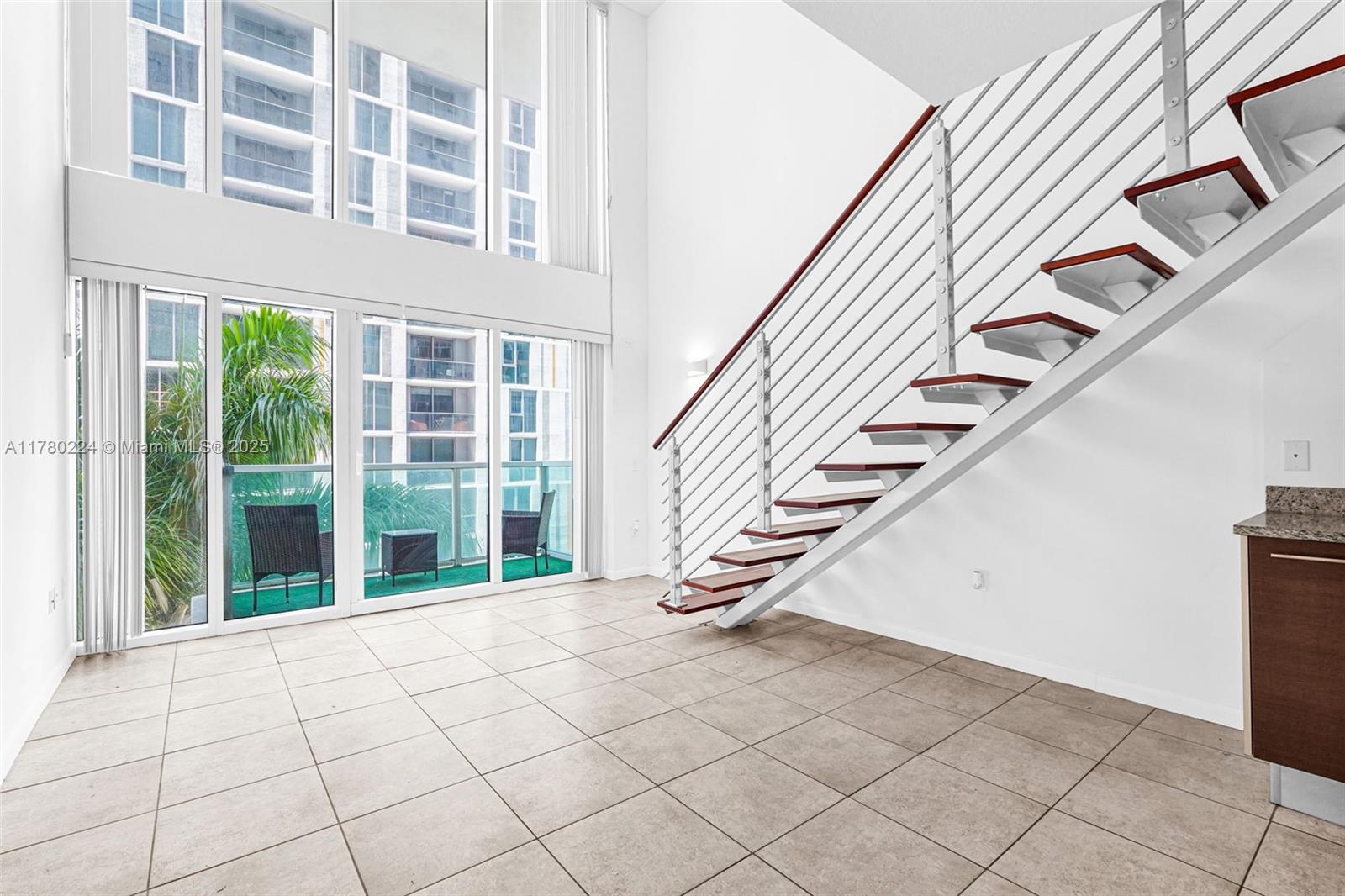 41 Southeast 5th Street, Unit 406 Miami, FL 33131 - Photo 4 of 68 a view of an entryway with staircase