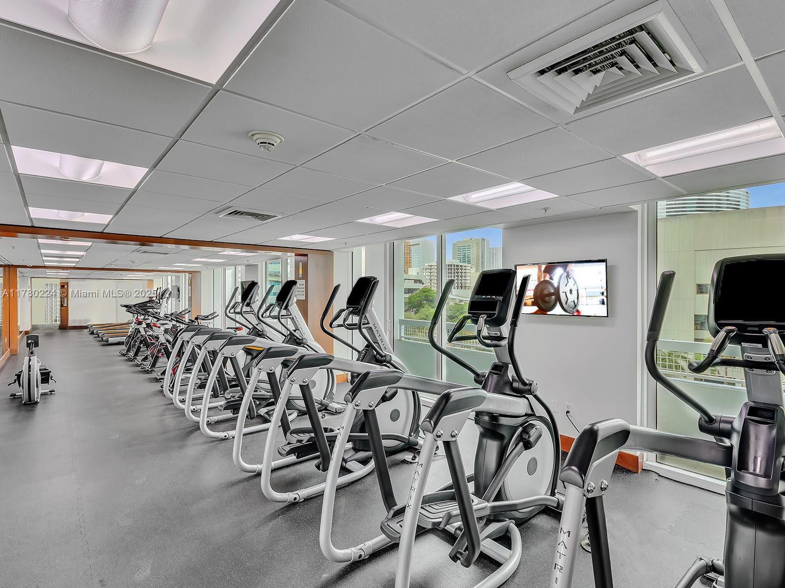 41 Southeast 5th Street, Unit 406 Miami, FL 33131 - Photo 56 of 68 a view of a room with gym equipment