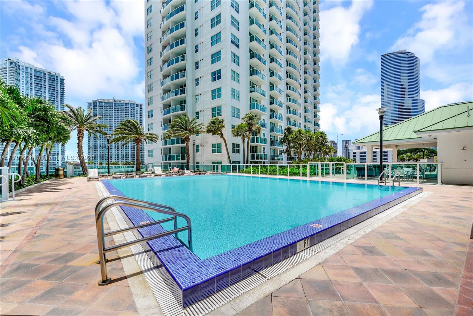 41 Southeast 5th Street, Unit 406 Miami, FL 33131 - Photo 63 of 68 a view of a swimming pool with a terrace