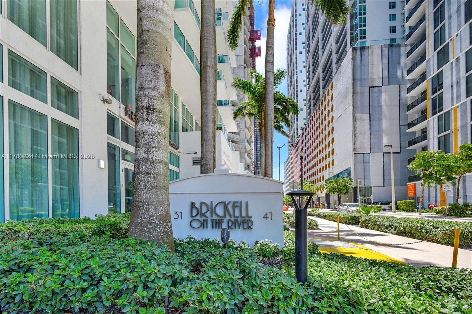 41 Southeast 5th Street, Unit 406 Miami, FL 33131 - Photo 68 of 68 a view of a building with a yard