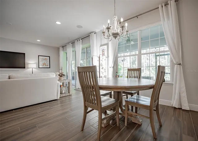 a large bathroom with a double vanity sink a large mirror and a bathtub