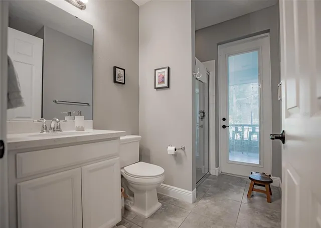a view of staircase with wooden floor and white walls