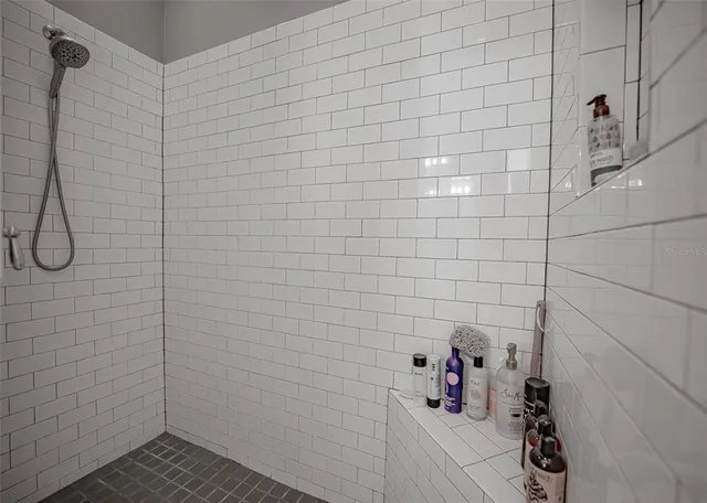a bathroom with a shower curtain and a sink
