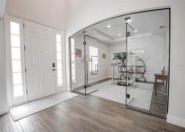 a view of a dining room with furniture and window