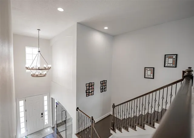 a view of a livingroom with furniture hardwood floor and a ceiling fan
