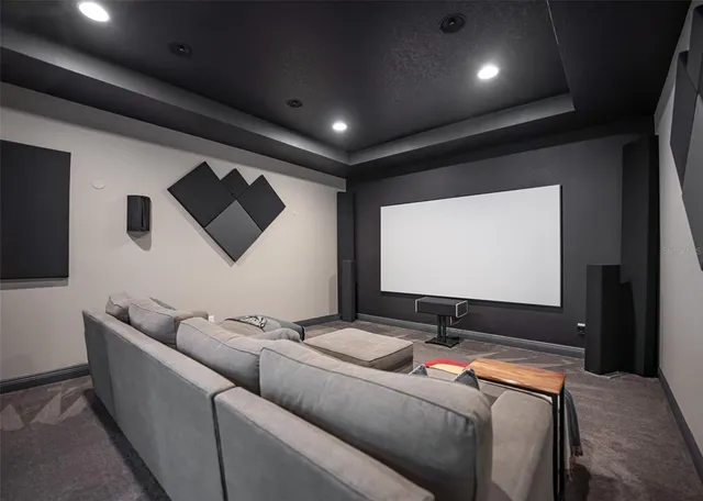 a front view of a house with a yard garage and outdoor seating