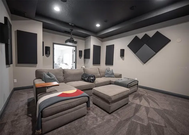 an aerial view of a house with garden space and a patio