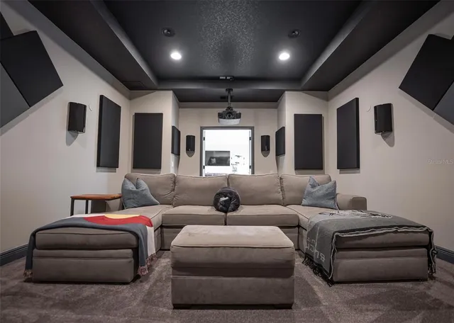 a aerial view of a house with a garden and lake view