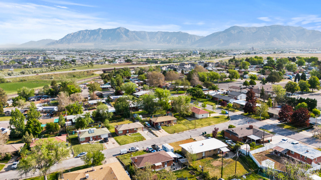 2101 West 3900th Street South Roy, UT 84067 - Photo 35 of 36 Aerial perspective showcasing a residential area with varied housing styles