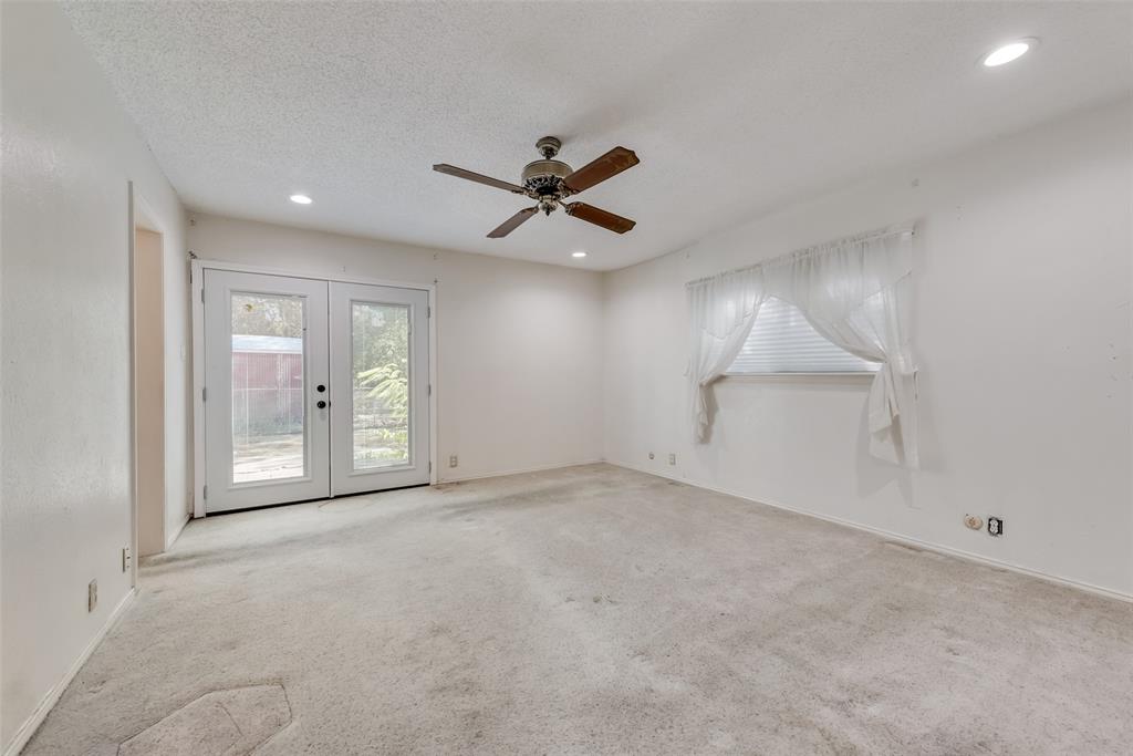 102 South Royal Oak Drive Duncanville, TX 75116 - Photo 15 of 19 an empty room with fan and windows