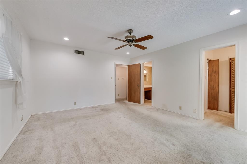 102 South Royal Oak Drive Duncanville, TX 75116 - Photo 16 of 19 an empty room with closet and a ceiling fan
