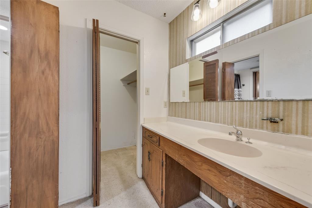 102 South Royal Oak Drive Duncanville, TX 75116 - Photo 17 of 19 a bathroom with a sink double vanity and a mirror