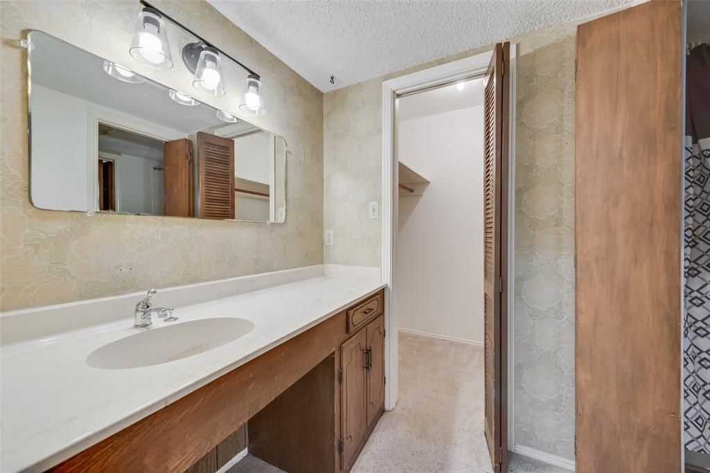 102 South Royal Oak Drive Duncanville, TX 75116 - Photo 19 of 19 a bathroom with a double vanity sink mirror and