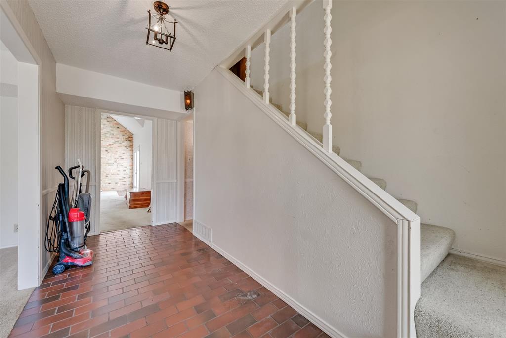102 South Royal Oak Drive Duncanville, TX 75116 - Photo 4 of 19 a view of entryway with wooden floor and stairs