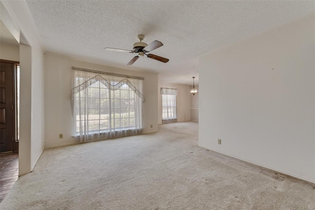 102 South Royal Oak Drive Duncanville, TX 75116 - Photo 5 of 19 a view of an empty room with a window