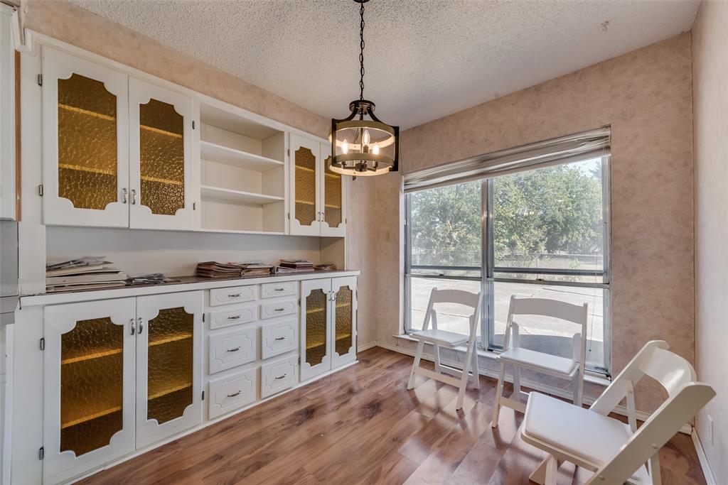 102 South Royal Oak Drive Duncanville, TX 75116 - Photo 9 of 19 a living room with stainless steel appliances granite countertop furniture a fireplace and windows