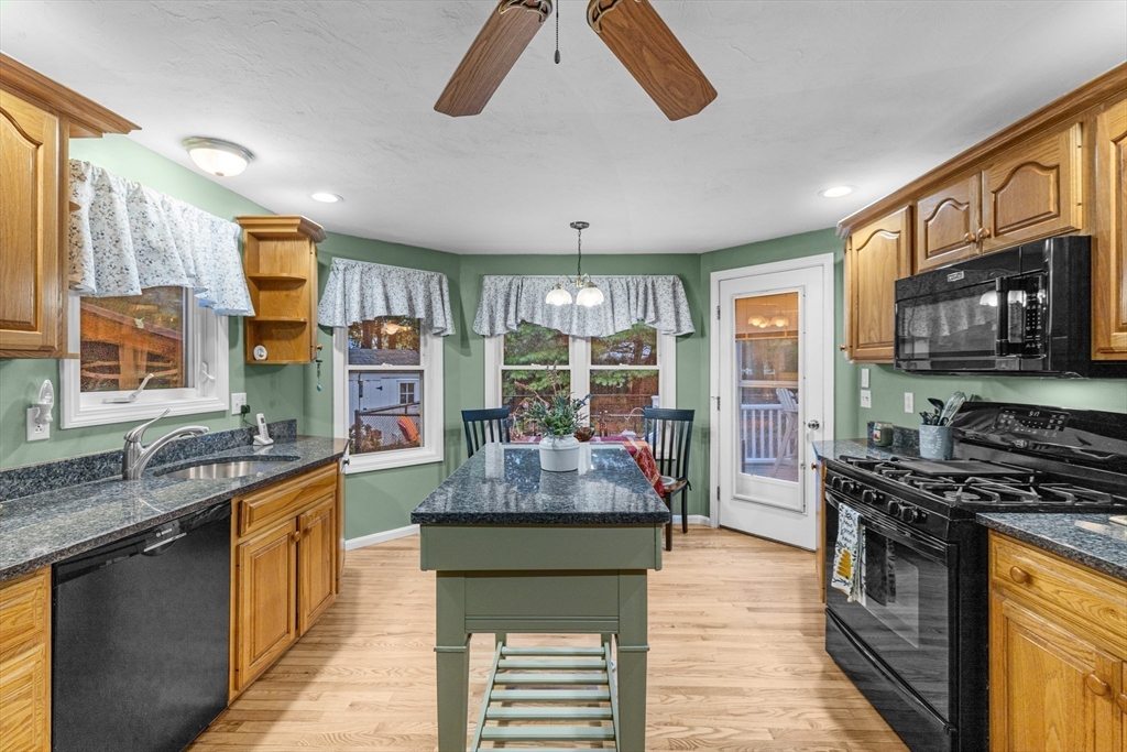 4 Penny Lane Wareham, MA 02558 - Photo 14 of 32 a kitchen with stainless steel appliances granite countertop a stove refrigerator and cabinets