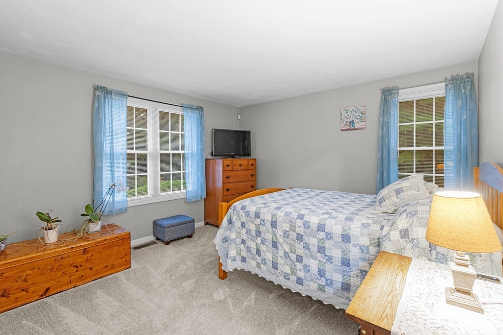 4 Penny Lane Wareham, MA 02558 - Photo 21 of 32 a bedroom with a bed and windows